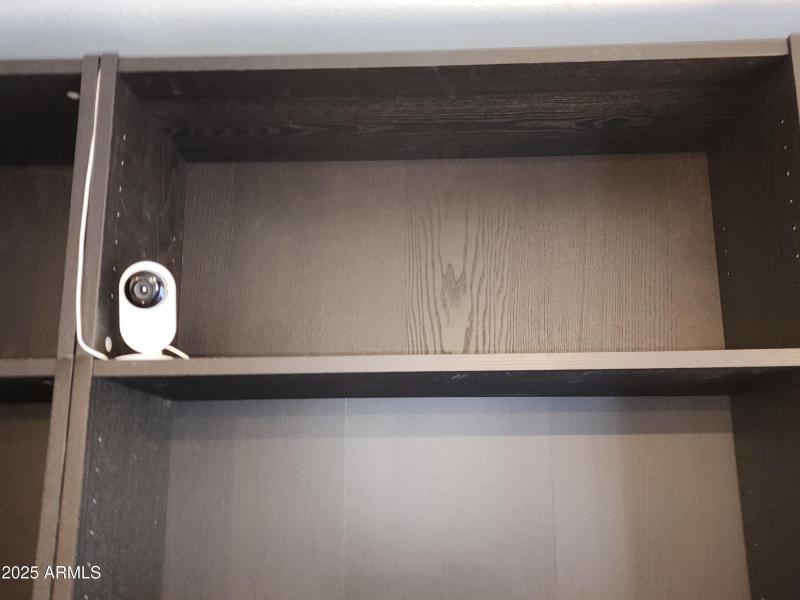 32. Security cameria on book shelf.