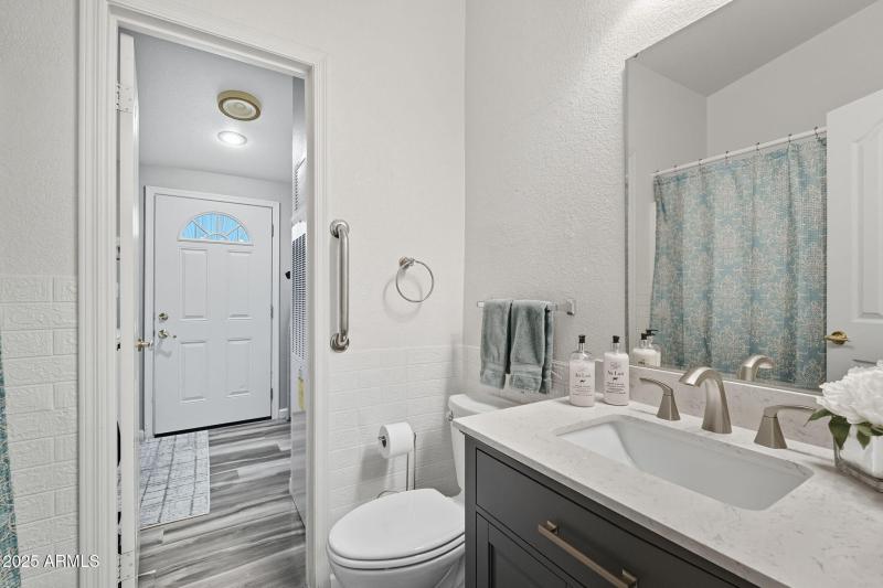 Guest bathroom view into laundry room
