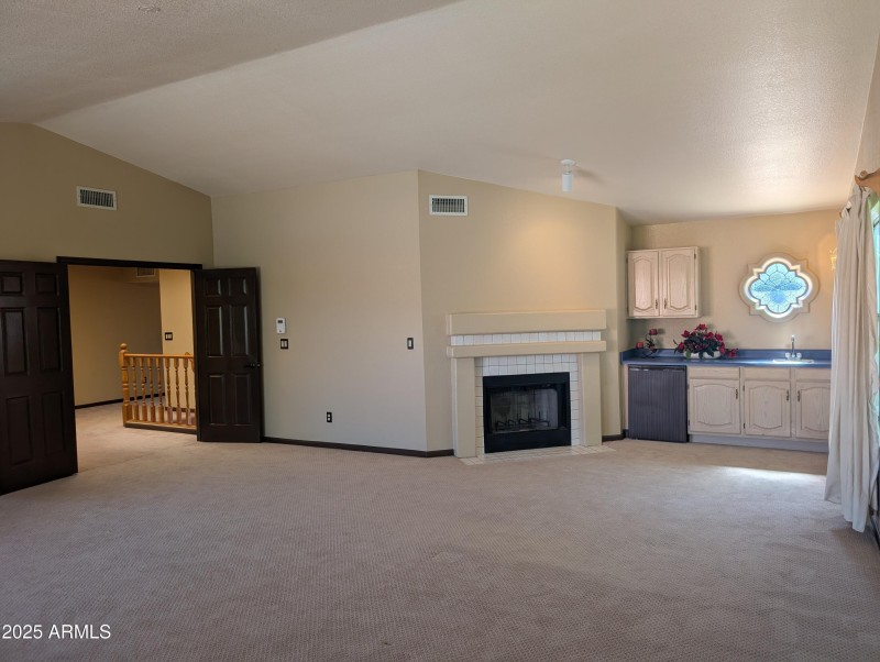 12 Primary bedroom with FP and wetbar