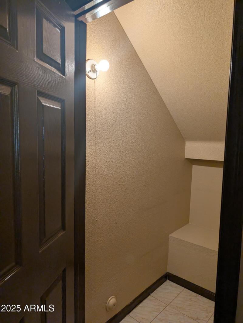 30 Extra storage underneath stairs.