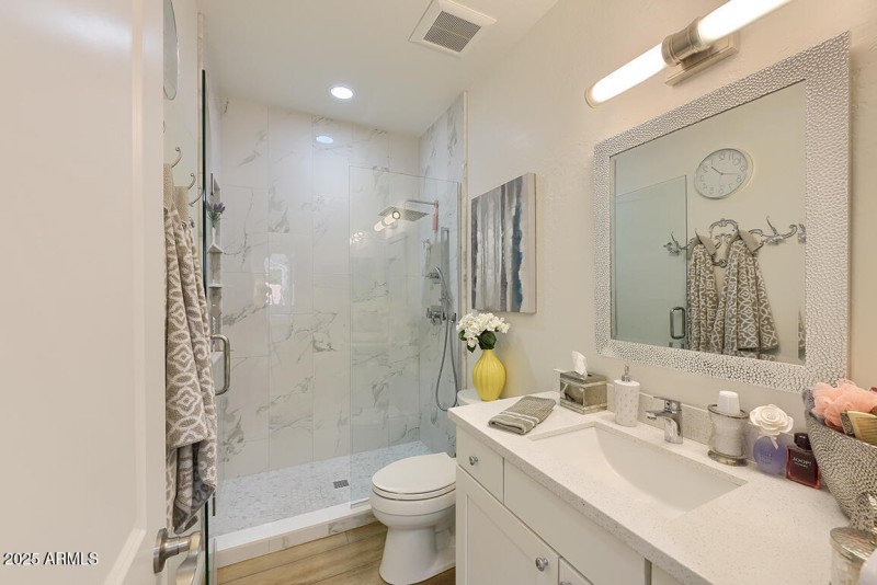 Floor-To-Ceiling Tile in Guest Bath
