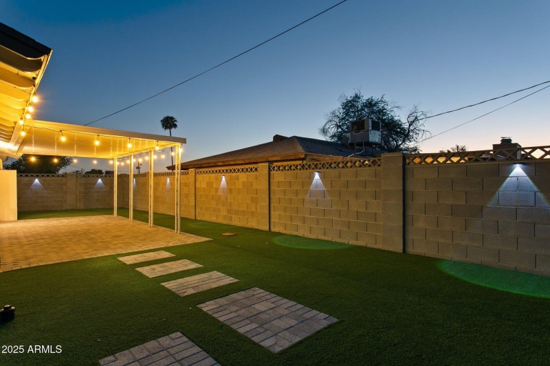 View to covered patio and new fence