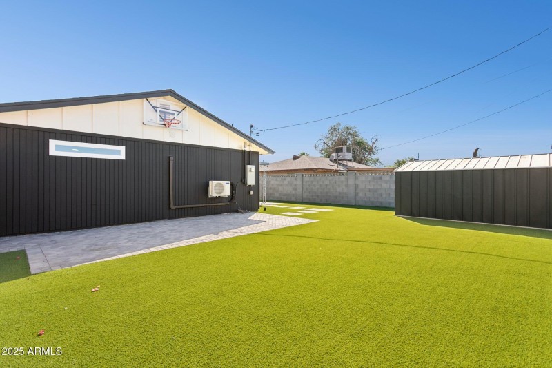 Synthetic lawn and new block wall