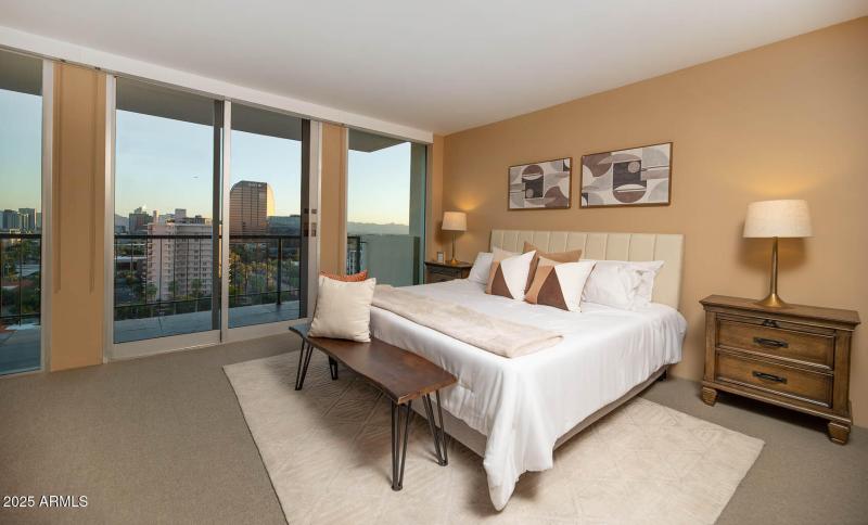 23 Primary Bedroom with Balcony and BMO