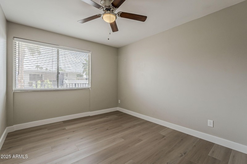 Bright Bedroom with Updated Flooring