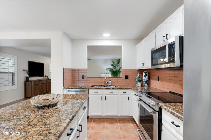 Kitchen area with pass through window