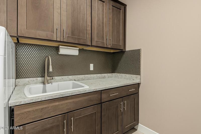Modern Laundry Room with Granite Counter