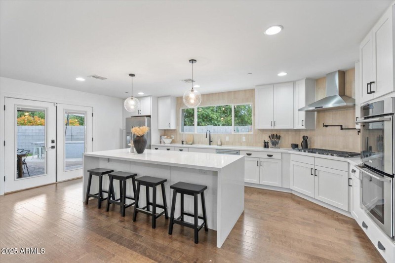 Large island opens to backyard oasis