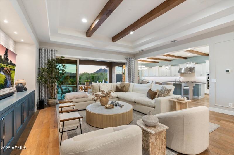 Wood beamed great room to kitchen mounta