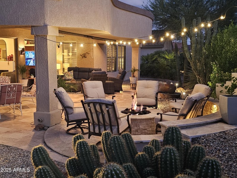 Patio at night looking into great room