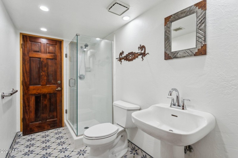 Bathroom with Door to Patio & Pool Area