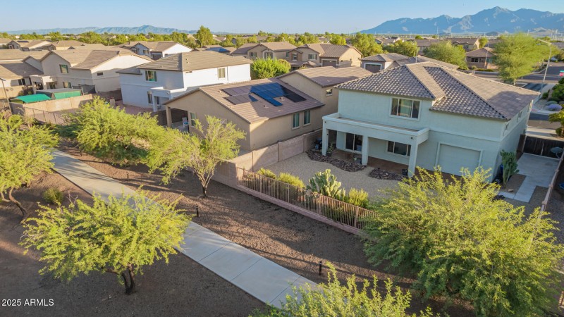 Drone of backyard & walkway behind