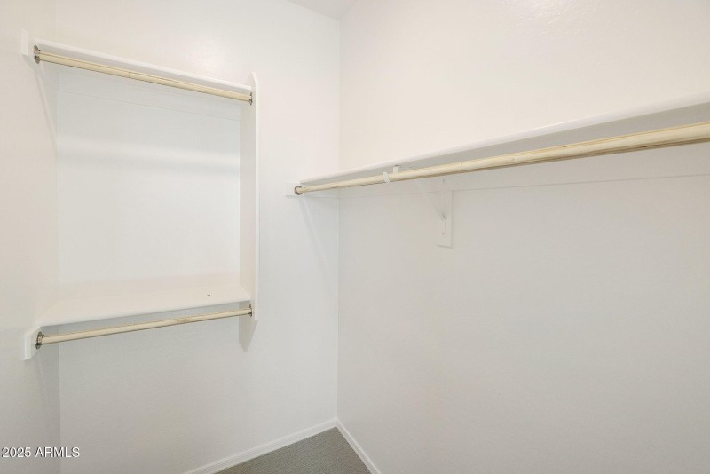 HALL BEDROOM WALK IN CLOSET.