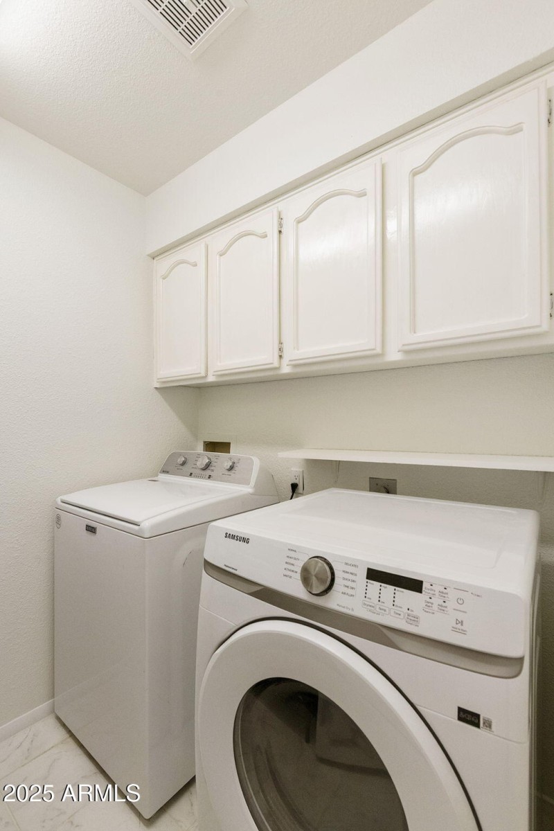 Laundry with cabinets