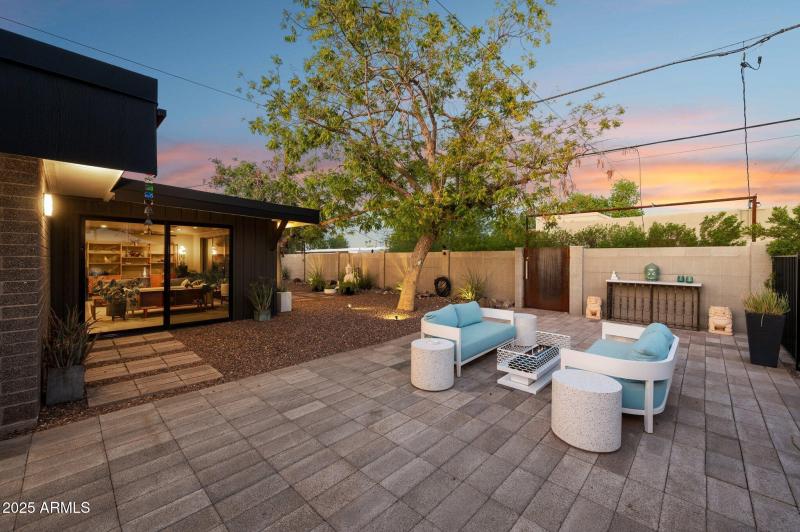 Paver-lined patio runs length of yard