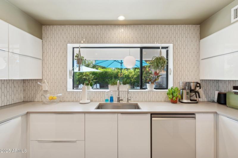 Kitchen overlooks rear yard