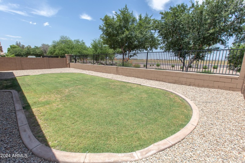 Grass and gravel backyard