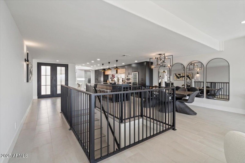 STAIRCASE TOWARD FRONT ENTRY