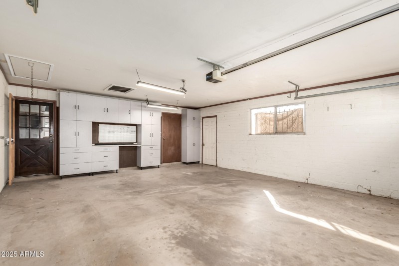 2 Car Garage w/ an extra room