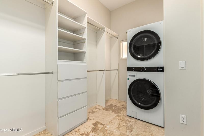 Upstairs laundry in master closet