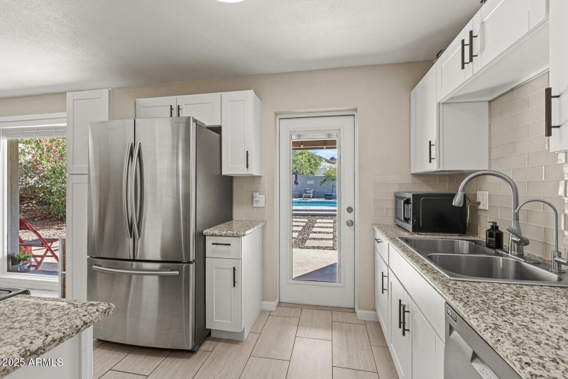 Kitchen - Spacious Backyard & Pool Views