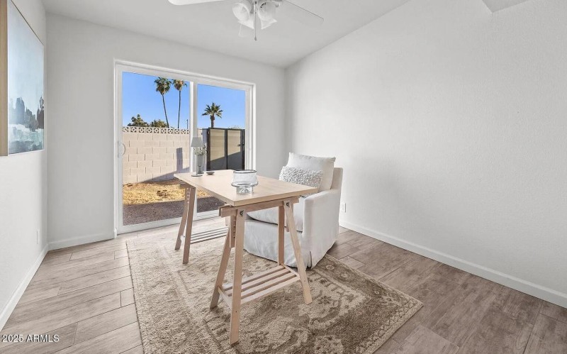 Secondary bedroom with door to side yard