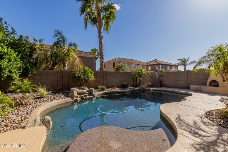 Sparkling Pool with Adobe Fire Pit