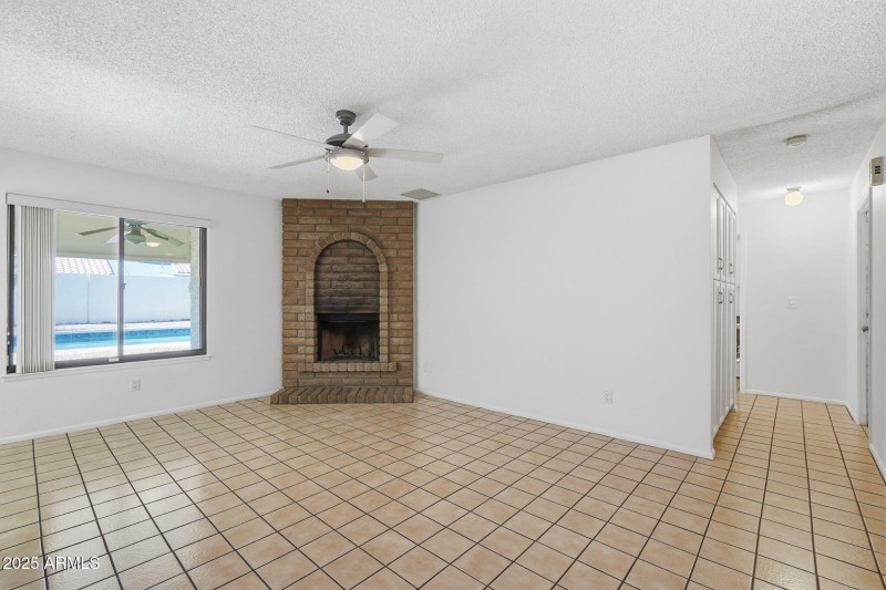 family room with wood burning fireplace