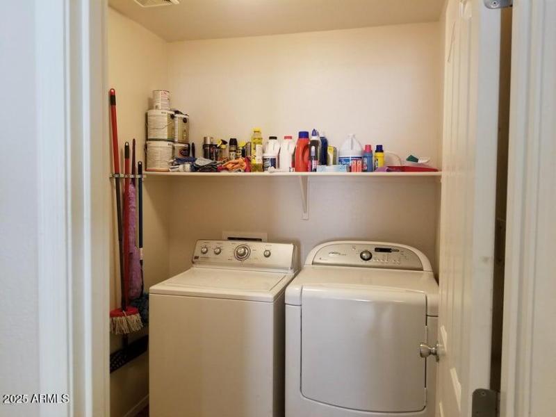 Indoor laundry behind kitchen for conven