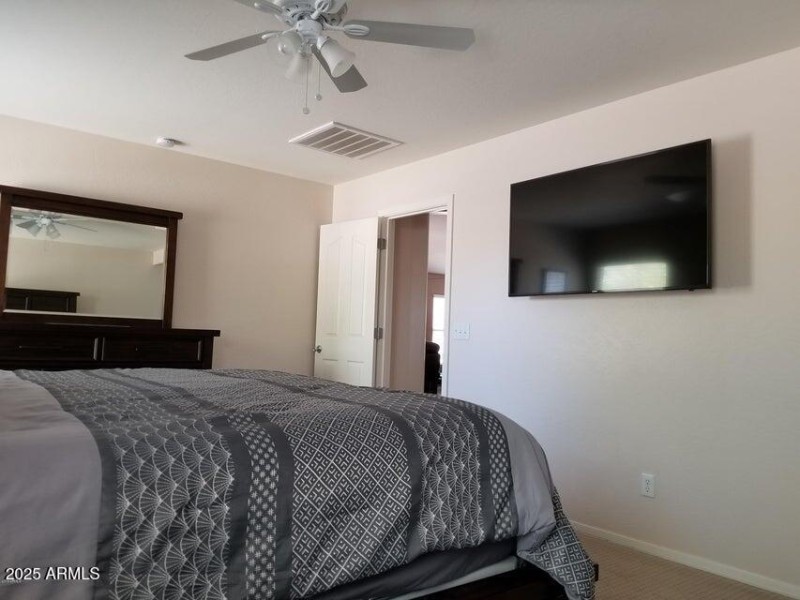 Wall mounted 55 inch TV in main bedroom