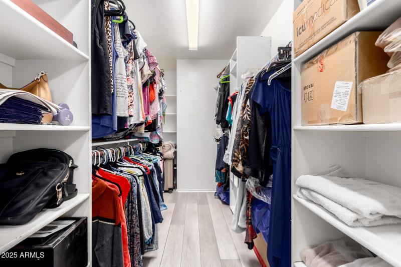 closet with 2 shelving areas
