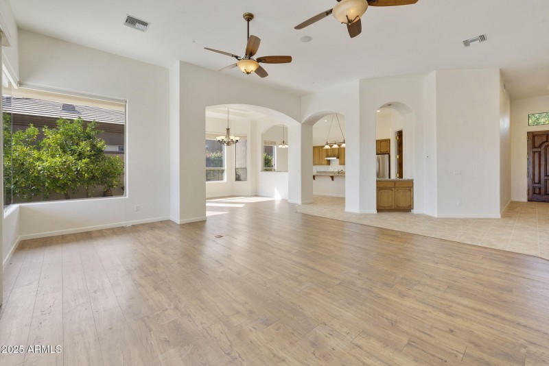 VIEW INTO FORMAL DINING AND KITCHEN