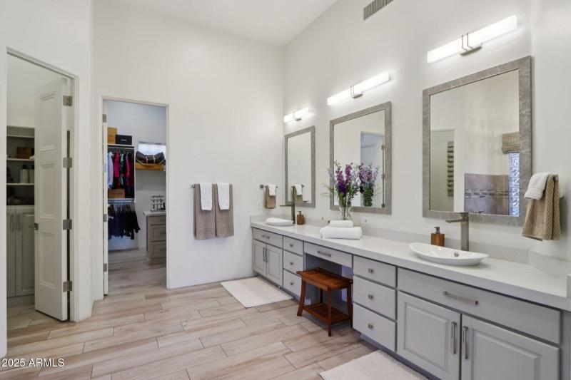Primary Bath With Dual Walk-In Closets