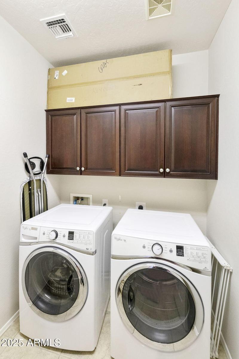 Laundry with cabinets