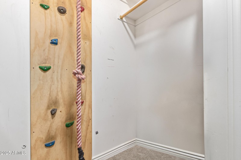Rock wall up to a hidden loft play room