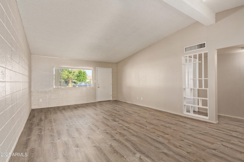 Living room facing front door and window