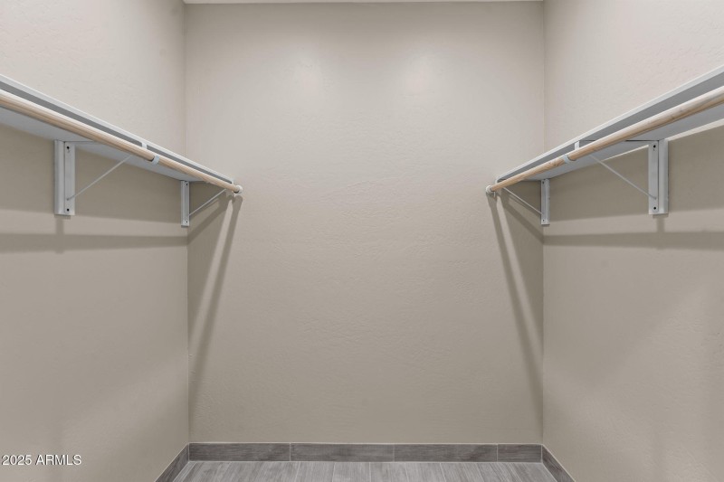 One of 2 primary walk-in closets