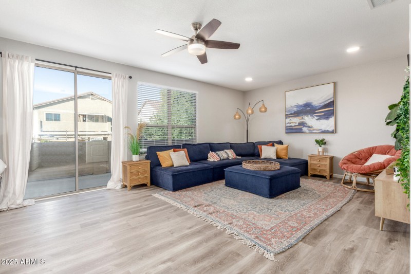 Large den upstairs with patio