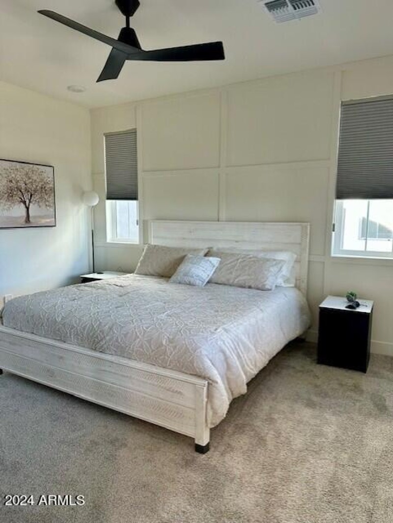 King bed in master bedroom with custom w