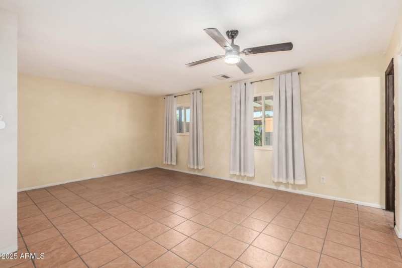 Large primary bedroom with two windows