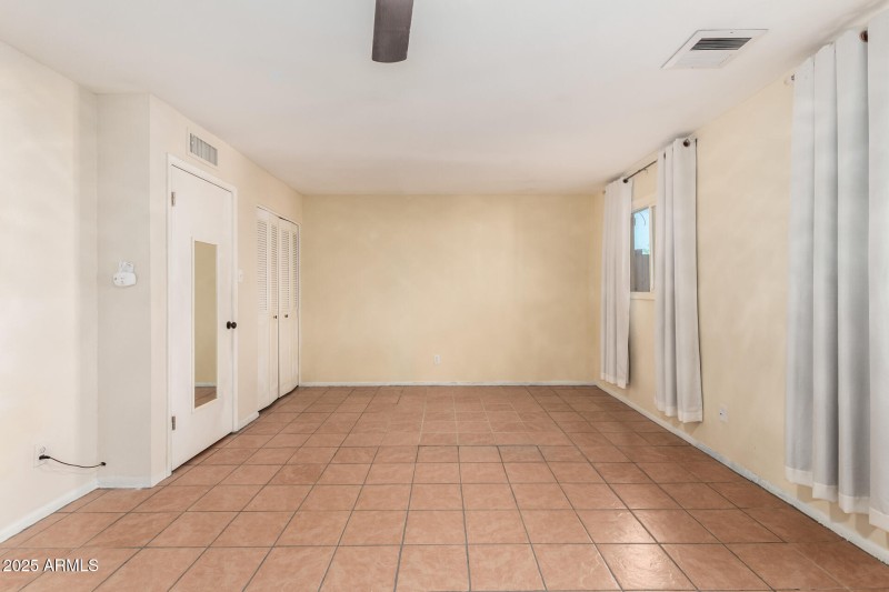 Primary bedroom at back of the home