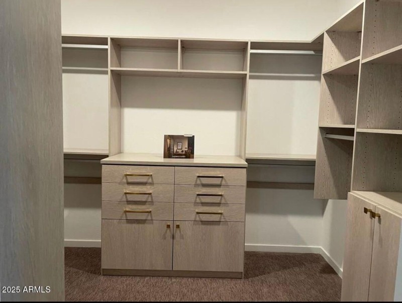 Huge Master Closet with Custom Cabinets