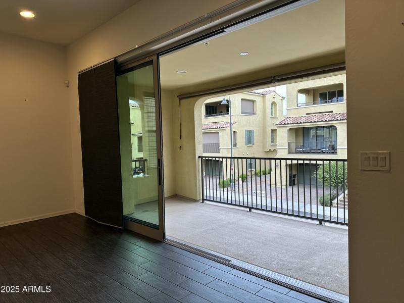 Kitchen glass wall open to large balcony