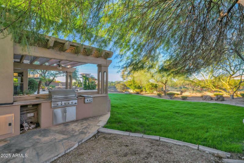 Backyard BBQ Area with Grass