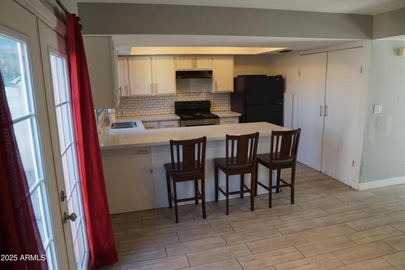 Kitchen and bar from family room