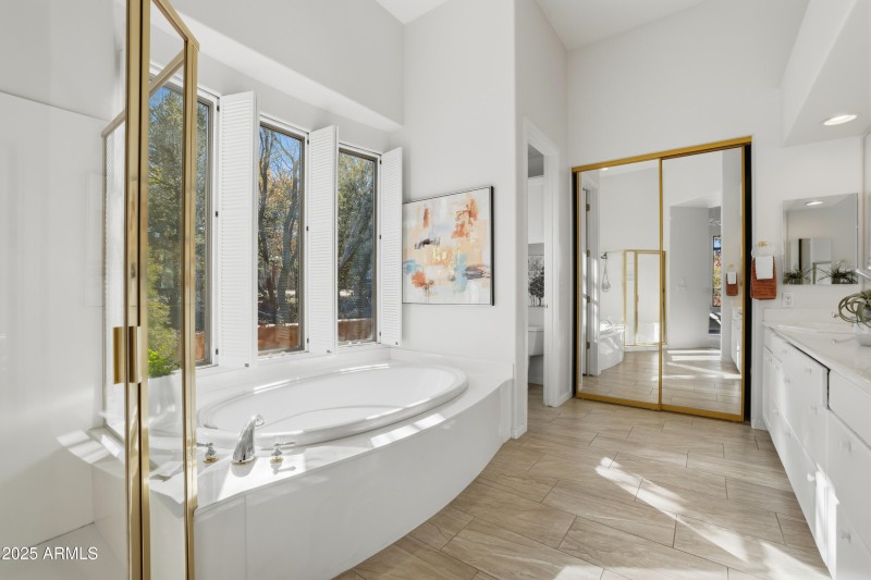 Boasting walk in closet and dual sinks!