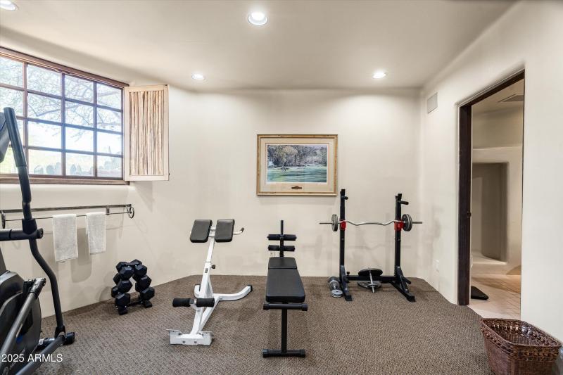 Guest Quarters downstairs bedroom/gym 56