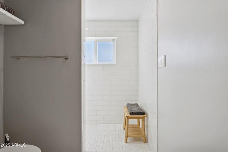 Floor-to-ceiling tiled shower
