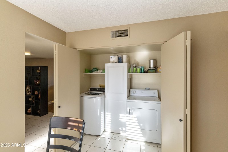 Laundry closet off kitchen