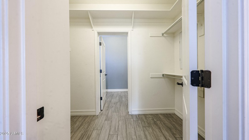 Walk-in Closet Connects to Laundry